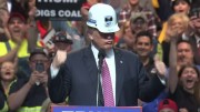 At a campaign rally in West Virginia, Republican presidential candidate Donald Trump appears in a miner's hard hat and mimics shoveling coal. Credit: Reuters.