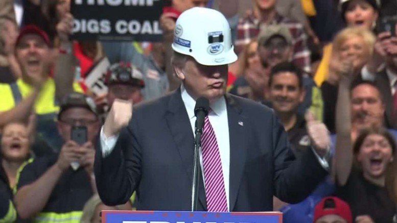 At a campaign rally in West Virginia, Republican presidential candidate Donald Trump appears in a miner's hard hat and mimics shoveling coal. Credit: Reuters.