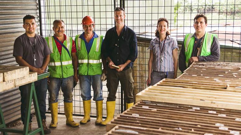 Toachi Mining exploration manager Phil Fox (fourth from left) with associates in a core facility in the village of Palo Quemado, Ecuador. Credit: Toachi Mining.