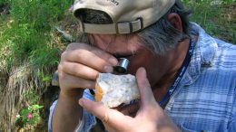 Prospector Shawn Ryan examining a rock at Underworld Resources' White Gold property in the Yukon in 2009. Photo by The Northern Miner.