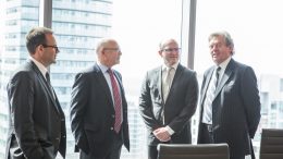 Roundtable participants mingle at the PwC office in Toronto. From left to right: Stephen Mullowney, a partner at PwC; Stephen Roman, Harte Gold CEO; John Cumming, TNM editor-in-chief; John Kearney, Canadian Zinc CEO.