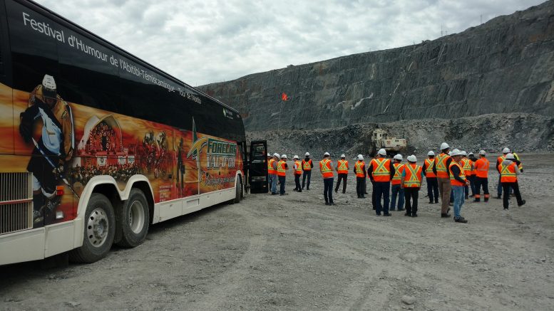 Visitors on the pit floor at Agnico Eagle Mines and Yamana Gold's Canadian Malartic gold mine in Malartic, Quebec. Photo by John Cumming.