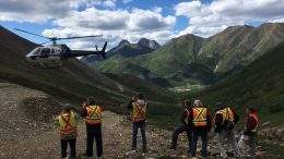 Newsletter writers and analysts wait for the helicopter at Atac Resources' Rackla gold property in the Yukon. Photo by Lesley Stokes.