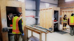 First Mining Staff cut core at Goldlund's facility near Dryden, Ontario. Credit: First Mining.
