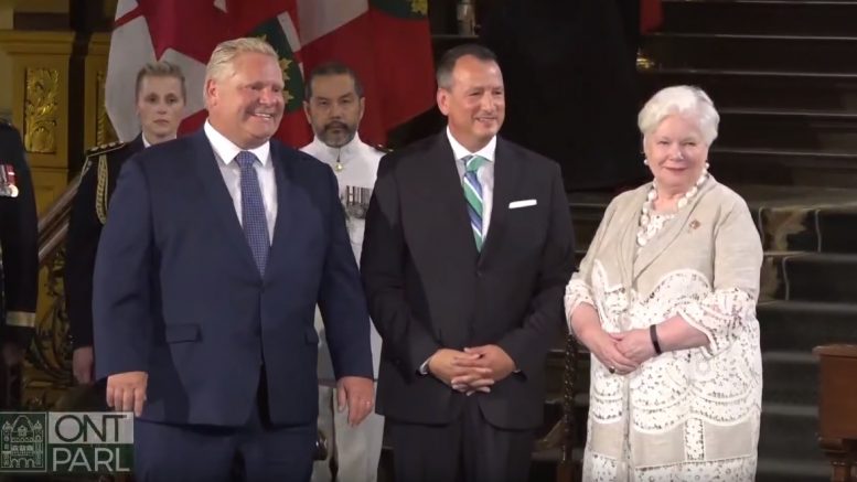 At the swearing-in ceremony for the new Ontario cabinet at Queen's Park in Toronto on June 29, from left: Premier Doug Ford; Minister of Energy, Northern Development and Mines, and Minister of Indigenous Affairs Greg Rickford; and Ontario Lieutenant General Elizabeth Dowdeswell. Credit: Premier of Ontario YouTube Channel.