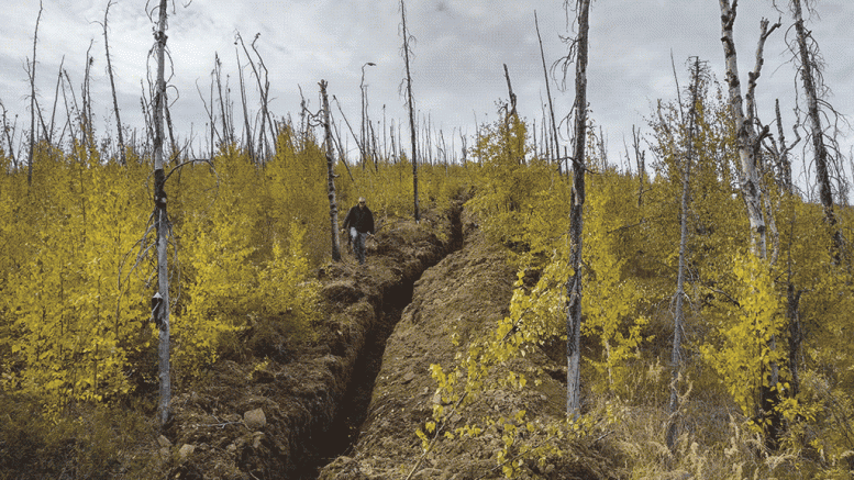 Geologist Cam Barker near a trench at K2 Gold’s Wels gold project in west-central Yukon, 185 km south of Dawson City. Credit: K2 Gold.