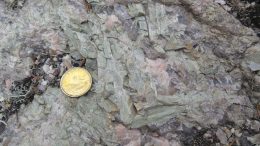 Small green spodumene blades in pegmatites at New Age Metals’ Lithium Two lithium project. Credit: New Age Metals.