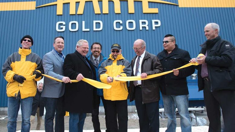 Cutting the ribbon at Harte Gold’s Sugar Zone gold mine in Ontario, from left: Timothy Campbell, Harte Gold VP and corporate secretary; Greg Rickford, Ontario Minister of Energy, Mines, Northern Development and Indigenous Affairs; Doug Ford, Premier of Ontario; Jeff Desmoulin, former chief of Pic Mobert First Nation; Stephen Roman, Harte Gold president and CEO; Angelo Bazzoni, mayor of White River; Louis Kwissiwa, acting chief of Pic Mobert First Nation; and Roger Emdin, Harte Gold VP of operations. Credit: Harte Gold.