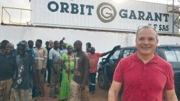 Sylvain Drolet (far right), director general of Orbit Garant Burkina Faso, at the company’s office in Burkina Faso. Credit: Orbit Garant.