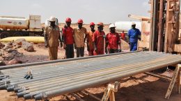 Workers pose with drill rods at Global Atomic's DASA project in Niger. Credit: Global Atomic.