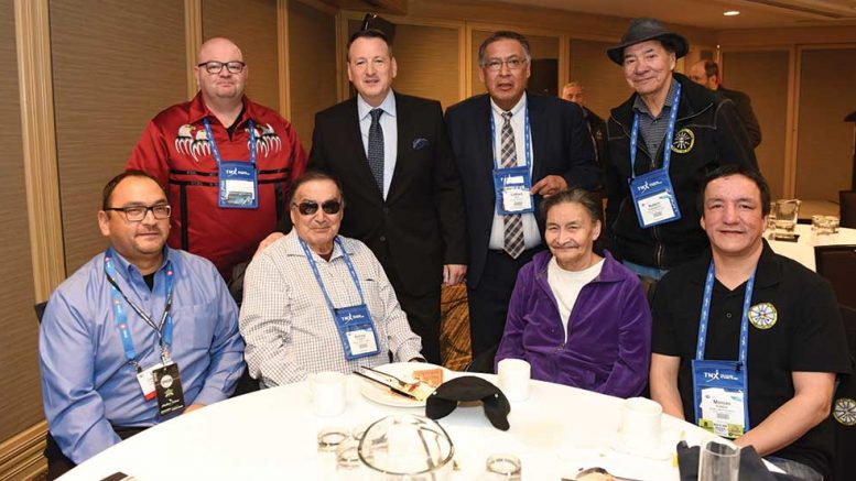 Greg Rickford (back row, second from left), Ontario Minister of Northern Development and Mines, Energy and Indigenous Affairs, with representatives from First Nations at the 2019 PDAC convention in Toronto. Credit: Ontario Ministry of Northern Development and Mines, Energy and Indigenous Affairs.
