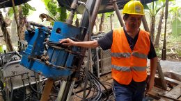 Salazar Resources founder, president and CEO Fredy Salazar with a drill rig in 2018 at the Curipamba VMS project in Ecuador. Adventus Zinc is earning a 75% stake in the project. Credit: Salazar Resources.