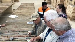 Toachi Mining board members Ebe Scherkus and Laurie Curtis reviewing core with Dr. Mike Druecker (from right to left) at a core facility in the village of Palo Quemado, Ecuador. Credit: Toachi Mining Inc.